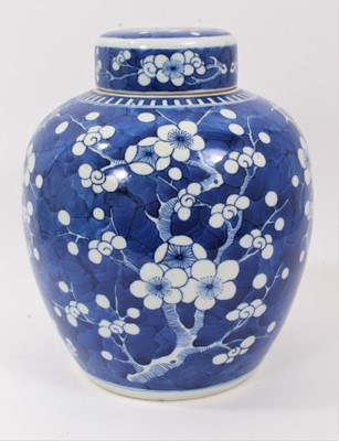 Lot 187 - Chinese blue and white porcelain ginger jar and cover, c.1900, decorated with prunus blossom, double-ring mark to base, 25.5cm high