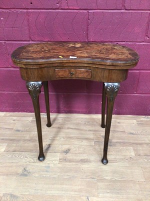 Lot 387 - Walnut veneered kidney shape card table with fold over revolving top and drawer below on cabriole legs,  76cm wide, 74.5cm high