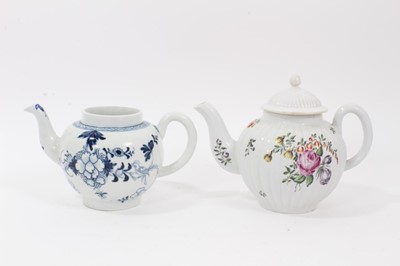 Lot 201 - Derby teapot, c.1756, of fluted form, polychrome painted with flowers (replacement cover) and a Liverpool teapot, painted in blue with flowers and birds (2)