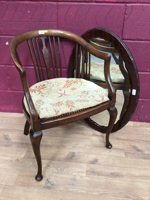 Lot 390 - Edwardian mahogany tub chair with caned seat and a mahogany framed oval wall mirror (2)