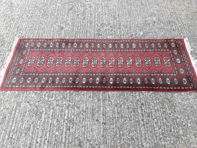 Lot 396 - Eastern runner with geometric decoration, 184cm x 64cm