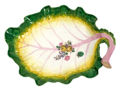 Lot 211 - Chelsea cabbage-leaf-shaped dish, c.1756, polychrome painted with naturalistic details and a floral spray, 24cm long