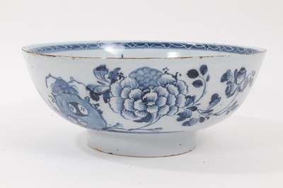 Lot 222 - 18th century English blue and white delftware bowl, painted with flowers in the Oriental style, 22.5cm diameter