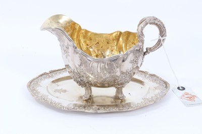 Lot 37 - Late 19th Century German Silver Sauce Boat of oval form, from the Royal Prussian Collection, with reeded border, repousse and chased with rocaille, flowers and foliage, with bifurcated foliage-capp...