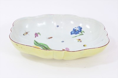 Lot 248 - Chelsea porcelain dish, c.1750-52, polychrome painted with insects, fruit and flowers, the outside pale yellow, 27.5cm long