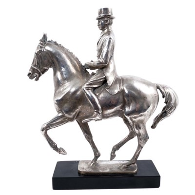 Lot 906 - Bernard Winskill (d. 1980) fine sterling silver model of a horse and rider, in the manner of a dressage competition, hallmarked and raised on black marble plinth, approximately 32cm long