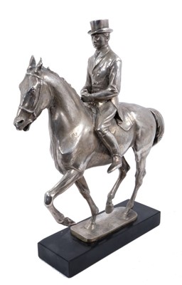 Lot 906 - Bernard Winskill (d. 1980) fine sterling silver model of a horse and rider, in the manner of a dressage competition, hallmarked and raised on black marble plinth, approximately 32cm long