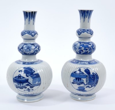 Lot 255 - Pair of 18th/19th century Chinese blue and white triple gourd vases, the main sections ribbed, painted with panels containing precious objects