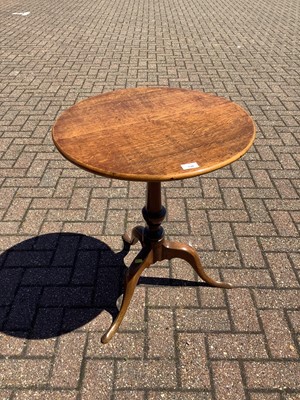 Lot 130 - Antique tilt top wine table on turned column and three splayed legs, 56cm diameter
