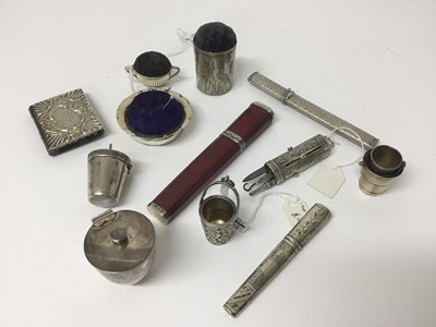 Lot 897 - Georgian silver mounted red leather needle case, of tapered canted form with removable cover, 10.5cm long, together with two silver needle cases, an unusual Victorian silver etui, with four rising...