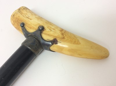 Lot 964 - 19th century walking cane with ebonised shaft, white metal mount and Marine ivory handle.
