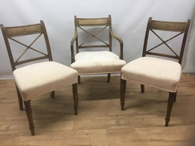 Lot 1431 - Set of ten Regency mahogany dining chairs with X shaped splat and stuff over seat and ring turned legs, comprising eight standards and two carvers