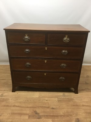 Lot 1433 - George IV mahogany chest of two short and three long drawers, with oval brass handles, parquetry crossbanding and bracket feet