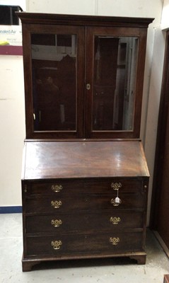 Lot 1437 - George III mahogany bureau bookcase, the upper section with dentil cornice and enclosed by a pair of glazed doors, with fitted bureau and four long drawers below on bracket feet, 97cm wide x 63cm d...