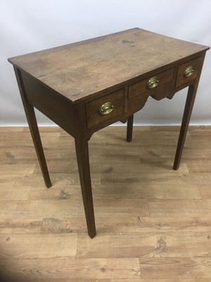 Lot 1438 - George III oak lowboy with three drawers to the shaped frieze, on square taper legs, 76cm wide x 47cm deep x 79cm high