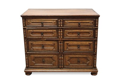 Lot 1443 - Late 17th / early 18th century oak geometric chest having four long graduated drawers, each with split pilaster ornament, on bun feet 94cm wide x 56cm deep x 85cm high
