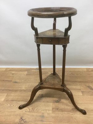 Lot 1445 - George III mahogany wash stand with dish ring raised over triangular drawer tier, a further tier below and tripod base