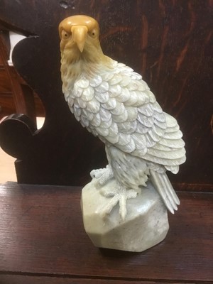 Lot 312 - A whole stone carved eagle