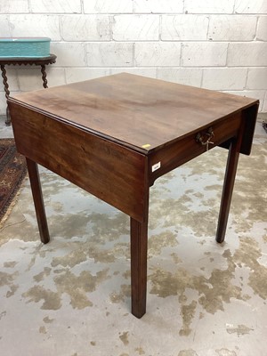 Lot 1416 - George III mahogany pembroke table, with rectangular hinged top and end frieze drawer on internally chamfered square tapered legs, top 75 x 67cm extending to 75 x 110cm