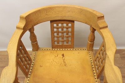 Lot 1299 - Robert Mouseman Thompson carved oak tub chair, with lattice back and stud closed leather seat on chamfered supports with signature mouse to front leg