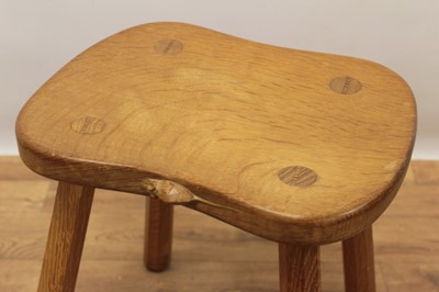 Lot 1298 - Robert Mouseman Thompson oak stool, with saddle seat, signature mouse to one side