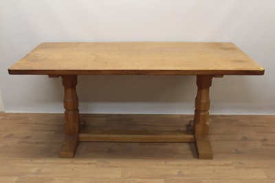 Lot 1296 - Robert Mouseman Thompson carved oak refectory table, rounded rectangular adzed top on facetted ends and sledge base united by a foot stretcher. signature mouse to one pedestal, 86 x 170cm