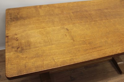 Lot 1296 - Robert Mouseman Thompson carved oak refectory table, rounded rectangular adzed top on facetted ends and sledge base united by a foot stretcher. signature mouse to one pedestal, 86 x 170cm