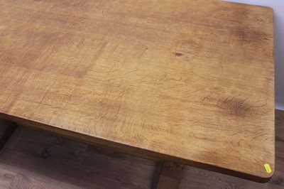 Lot 1296 - Robert Mouseman Thompson carved oak refectory table, rounded rectangular adzed top on facetted ends and sledge base united by a foot stretcher. signature mouse to one pedestal, 86 x 170cm