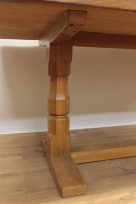 Lot 1296 - Robert Mouseman Thompson carved oak refectory table, rounded rectangular adzed top on facetted ends and sledge base united by a foot stretcher. signature mouse to one pedestal, 86 x 170cm