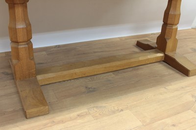Lot 1296 - Robert Mouseman Thompson carved oak refectory table, rounded rectangular adzed top on facetted ends and sledge base united by a foot stretcher. signature mouse to one pedestal, 86 x 170cm