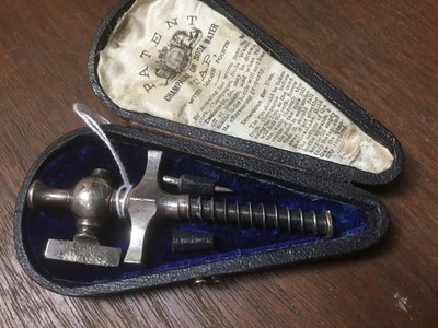 Lot 228 - Vintage champagne tap in fitted leather case