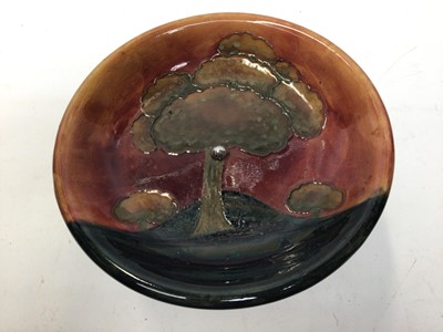 Lot 1033 - Moorcroft pottery flambe tazza decorated with trees in landscape on pewter base, impressed marks, 22cm diameter, 15cm high