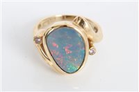 Lot 3267 - Gold (14ct) opal doublet dress ring with a...
