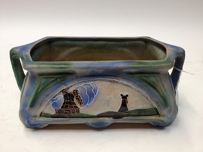 Lot 1092 - 1930s Denby Danesby Ware two handled planter decorated with windmills, 29cm wide, 11.5cm high, another similar and a vase, 18cm high (3)