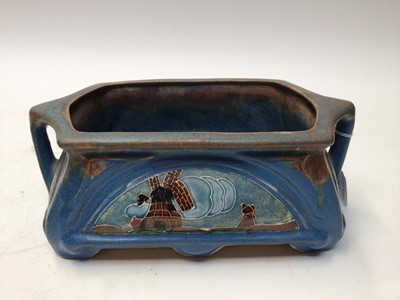 Lot 1092 - 1930s Denby Danesby Ware two handled planter decorated with windmills, 29cm wide, 11.5cm high, another similar and a vase, 18cm high (3)