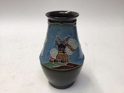 Lot 1092 - 1930s Denby Danesby Ware two handled planter decorated with windmills, 29cm wide, 11.5cm high, another similar and a vase, 18cm high (3)
