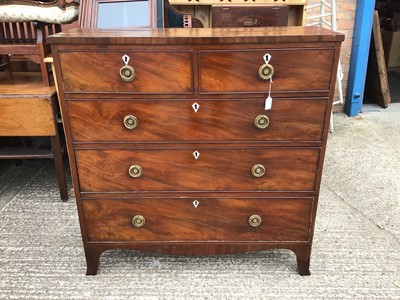 Lot 929 - George III mahogany chest of two short and three long drawers with brass ring handles, on bracket feet