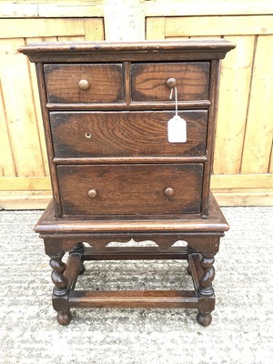 Lot 921 - 18th century-style oak miniature chest on stand with an arrangement of two short and two long drawers, on barley twist stand