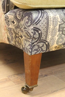 Lot 1400 - Late 19th / early 20th century easy chair by Howard & Sons Ltd.