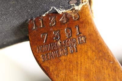 Lot 1400 - Late 19th / early 20th century easy chair by Howard & Sons Ltd.