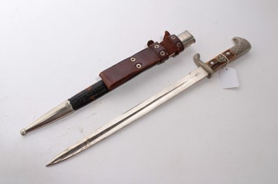 Lot 966 - Nazi Police Bayonet, with polished steel blade by Weyersberg, Kirschbaum & Co, Solingen, two piece horn grip with replacment badge and eagles head pommel, in leather scabbard with nickel plated mou...