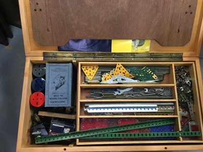 Lot 12 - Selection of Meccano in wooden fitted box including boxed electric motor, gears, wheels, pulleys etc (qty)