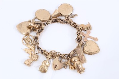 Lot 314 - 9ct gold charm bracelet