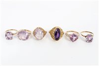 Lot 3206 - Five gold (9ct) amethyst dress rings and one...