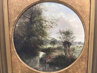 Lot 144 - Manner of George Lara, oil on circular board, a pair country scenes with figures by a river and a figure near a cottage (2)