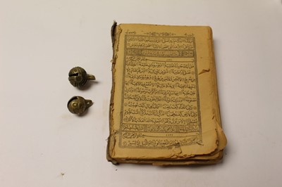 Lot 2619 - Persian printed version of Koran and two brass crotal bells
