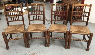 Lot 859 - Set of four 19th century style Lancashire spindle back chairs with rush seats on turned legs and stretchers
