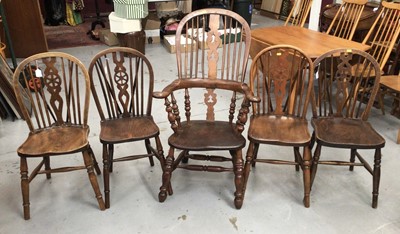Lot 853 - 19th century Windsor elbow chair and a set of four Windsor wheel back kitchen chairs with solid seats on turned legs