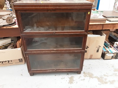 Lot 889 - Oak three section Globe - Wernicke bookcase, with label to interior