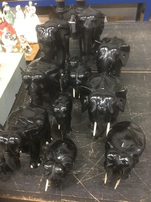 Lot 157 - Family of fourteen ebony carved elephants